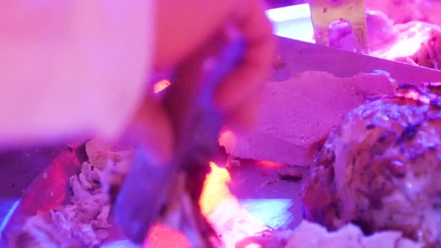 The cook cut the meat