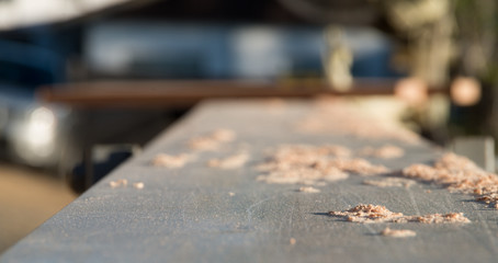Saw dust close up on a metal bench