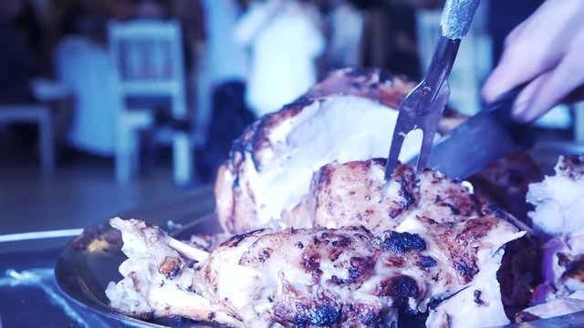 The cook cut the meat