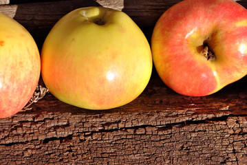 Apples row on wooden background