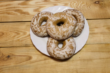 Delicious fragrant gingerbread in a plate and on a wooden table