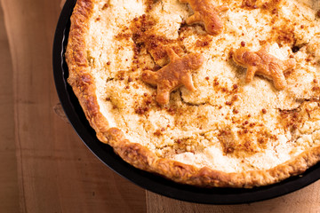 Food concept fresh baked homemade Apple crumble pie in pan on wooden background with copy space