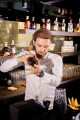 Alcohol cocktail on the bar. Bartender prepares an alcoholic cocktail . Delicious drink