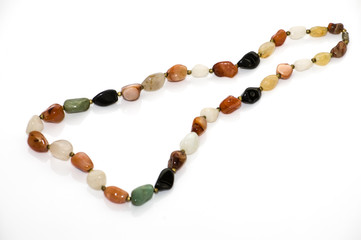 Female jewelry. Boho necklace with colorful beads istolated on a white background.