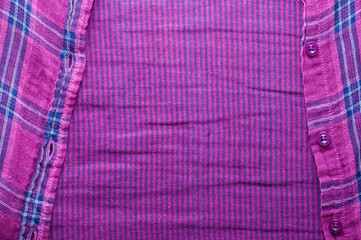 Textile texture of the checkered shirt, closeup the fastener useful as background