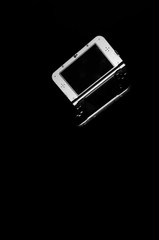 Game console on a black background.