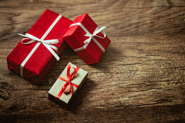 Christmas presents on wooden background, processed in vintage style