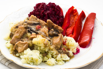 Stew with vegetables closeup on white plate, cooking concept