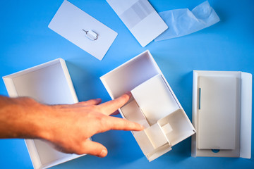 unpacked box from a smartphone on a blue background