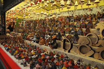 Florence, November 2018: Christmas Ornaments in a Christmas Market. colored lined little houses in a market, Italy. editorial image.