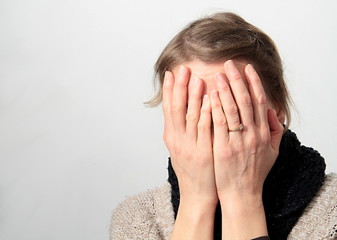 worried woman with hands on her head