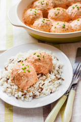 Chicken meatballs in creamy tomato sauce with rice