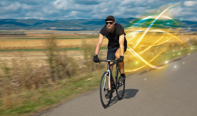 Fototapeta premium Young cyclist riding bicycle with magical landscape and concept