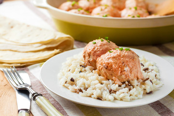 Chicken meatballs in creamy tomato sauce with rice