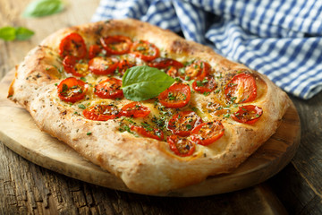 Tomato focaccia with fresh basil