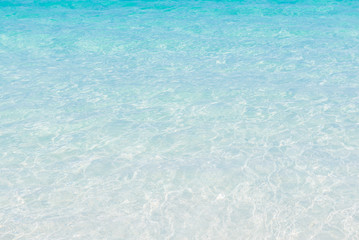 crystal clear sea water at tropical beach,reflections on surface of water