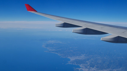 Obraz premium Red air plane on blue sky.