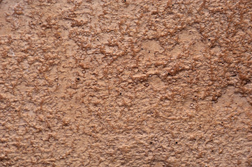 Rock concrete abstract neutral light beige wall background. Rustic wall surface for texture and background. Beige clay wall for wallpaper