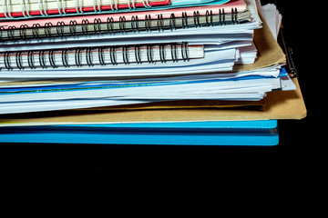 Stacked of office documents paper in the black background