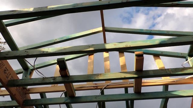 Timber roofing trusses rafters and batons treated pine carpenter pencil marks shadows tradies sparkies  chippy's put the construction jigsaw together