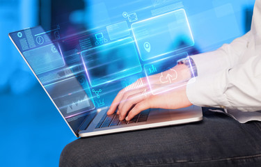 Hand using laptop with database reports and online work concept
