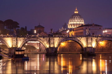 Fototapeta na wymiar Night image of St. Peter's Basilica, Ponte Sant Angelo and Tiber River in Rome