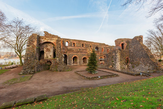 View to Ruins of the Kaiserpfalz (english: Emperor Palatinate) with big walls and the River Rhine in the background,  Duesseldorf, Germany