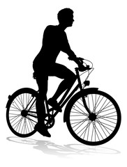 Obraz na płótnie Canvas A bicycle riding bike cyclist in silhouette