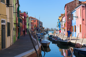 Fototapeta na wymiar Island Murano in Venice Italy, view of canal with boats