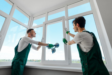 Men are installing a window