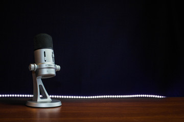 light bulb on microphone black background - Powered by Adobe