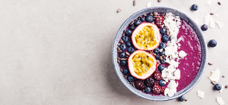 Smoothie Acai Bowl Served In Bowl On Grey Table