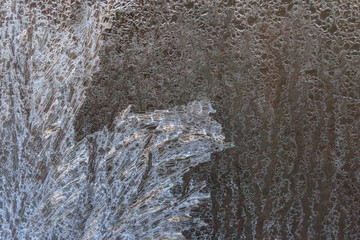 Frosty patterns on a frozen ice box in the early morning