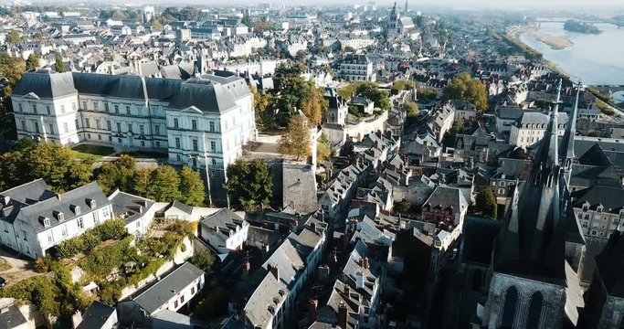 View from drone of French city of Blois with Royal Chateau and church of St. Nicolas in sunny autumn day
