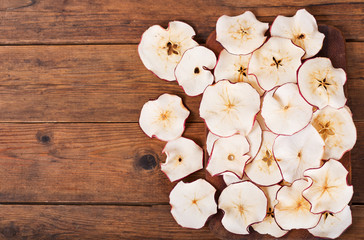dried apples on wooden table