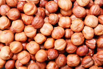 hazelnuts as background, top view