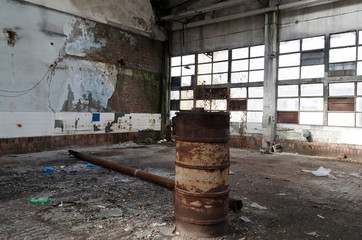 Ruins of abandoned factory or warehouse, large creepy and empty industrial constriction