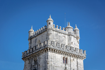 Fototapeta na wymiar Belem, Portugal - May 5th 2018 - A tourist looking through the window of the Belem Tower in blue sky day in Belem, Portugal