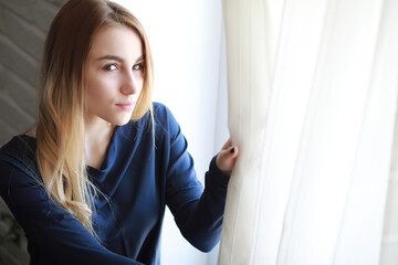 Naklejka premium Young girl at home relaxing