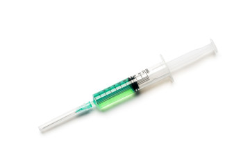 Fototapeta premium Syringe with green liquid on white