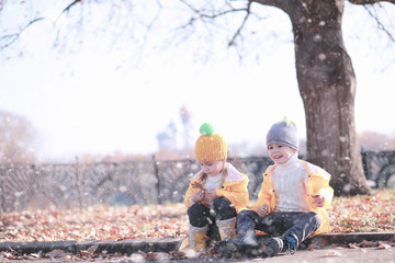 Kids walk in the park first snow