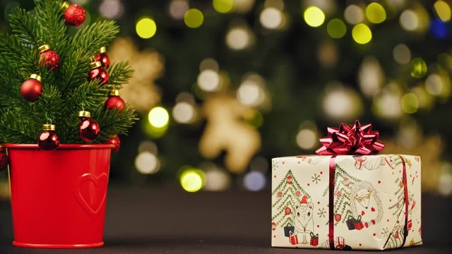 Christmas tree with gifts on bokeh background.