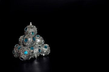 Shiny Christmas balls on a black background.