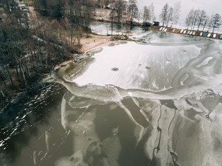 Aerial view of the winter frozen lake captured with a drone in Finland