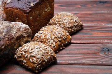 still life bread with grains on wooden background