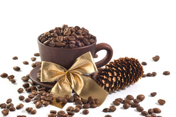A Christmas cup with coffee beans at the white isolated background.