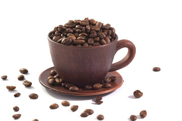 A coffee cup and coffee beans isolated at the white background.
