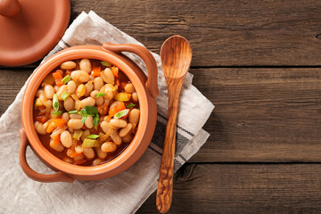Baked beans in tomato sauce and greens.