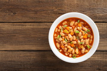 Baked beans in tomato sauce and greens.