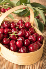 Sweet cherries in a wooden basket.